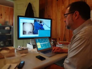 North examines a forehead scar from his office in Spruce Pine. Photo credit: Taylor Sisk