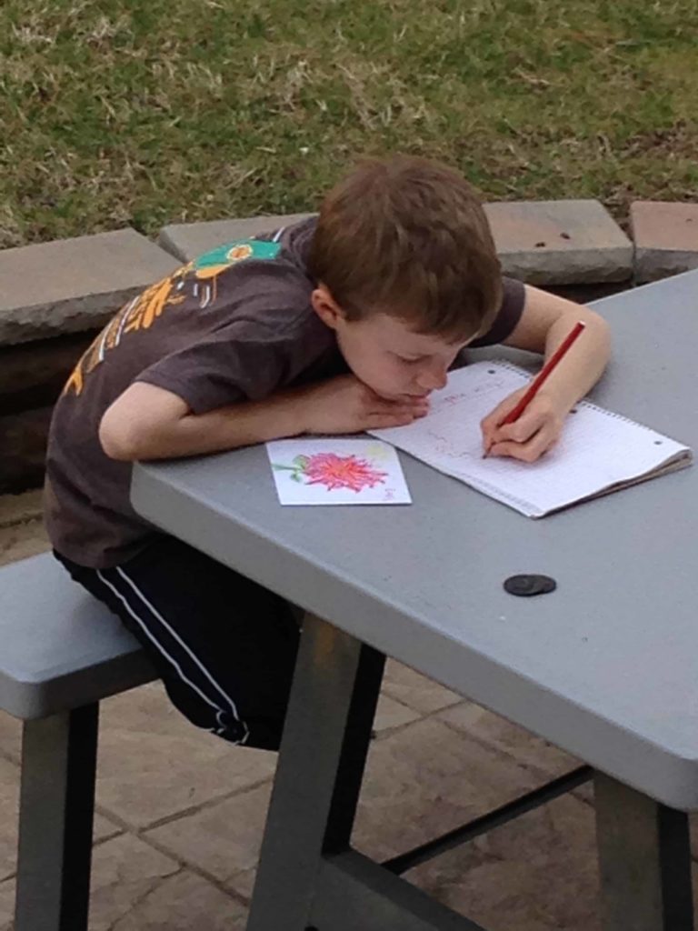 Louis Brandon journaling earlier this spring