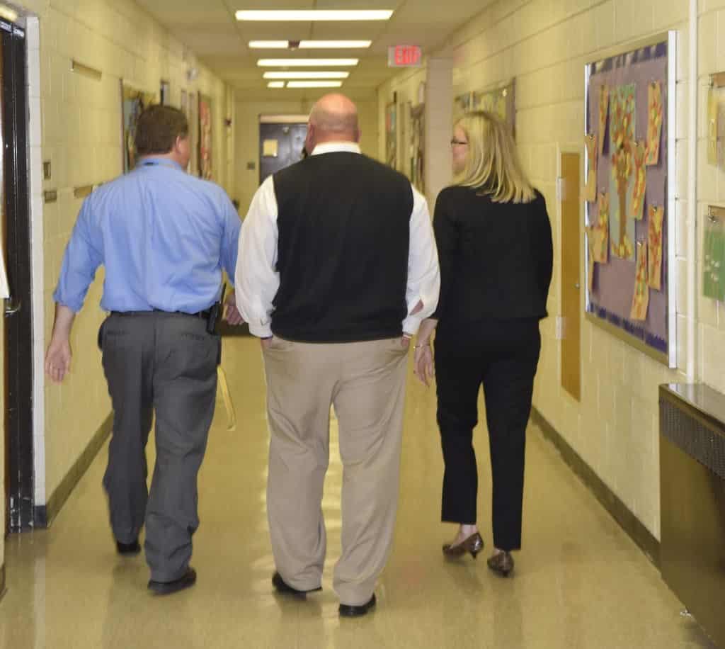 Principal Jonathan Hayes,  Assistant Superintendent of Curriculum and Instruction Dr. Paul Brannon, and Superintendent Dr. Lory Morrow walking the halls