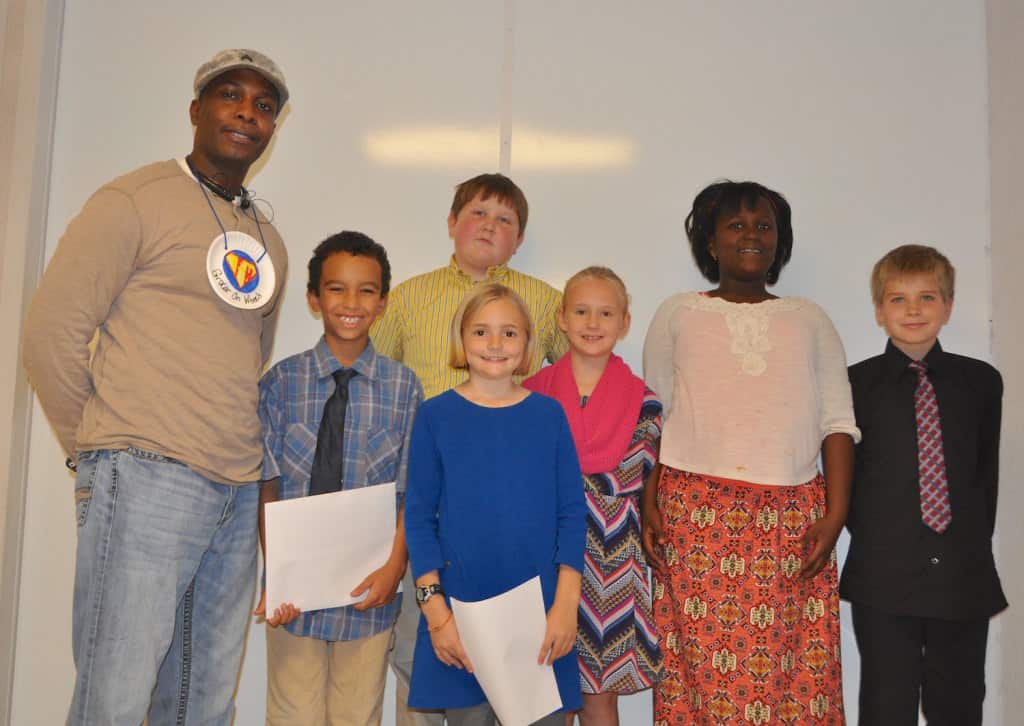 Food Hero Demetrius Hunter with Grocer on Wheels and Exploris students. (Credit: Sonja McKay)