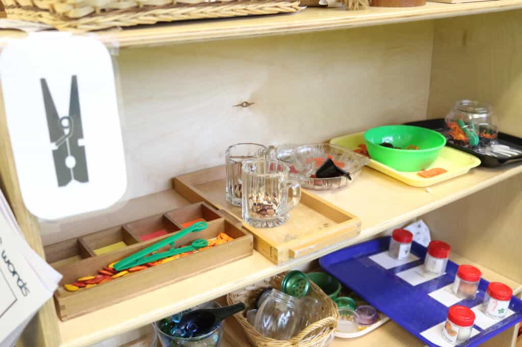 A fine-motor station, which has activities that help develop hand strength and eye-hand coordination, both of which help with handwriting skills.