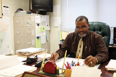 Done with the grind — Roosevelt Alston, who retired this year from his job as principal of Bunn Middle School, saw firsthand the effects of budget cuts to public education. (Photo credit: Ricky Leung)