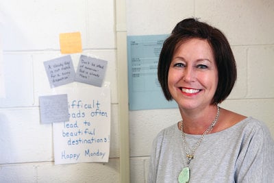 More than a teacher — Second grade teacher Barbara Dell Carter and her colleagues must rely on fewer resources than ever to respond to all of the emotional, medical and academic needs of their students. (Photo credit: Ricky Leung)
