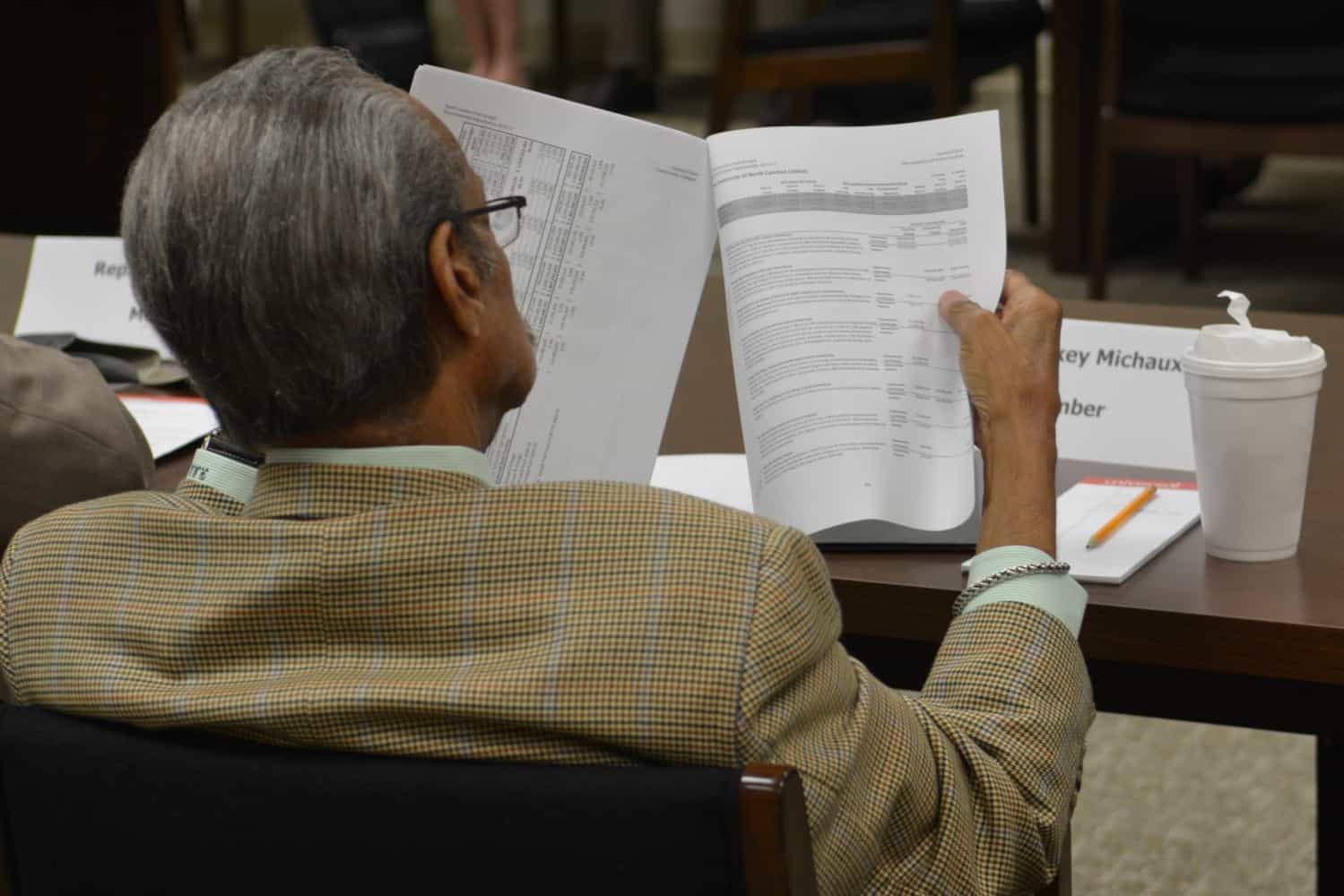 Rep. Mickey Michaux reads the Governor's budget.