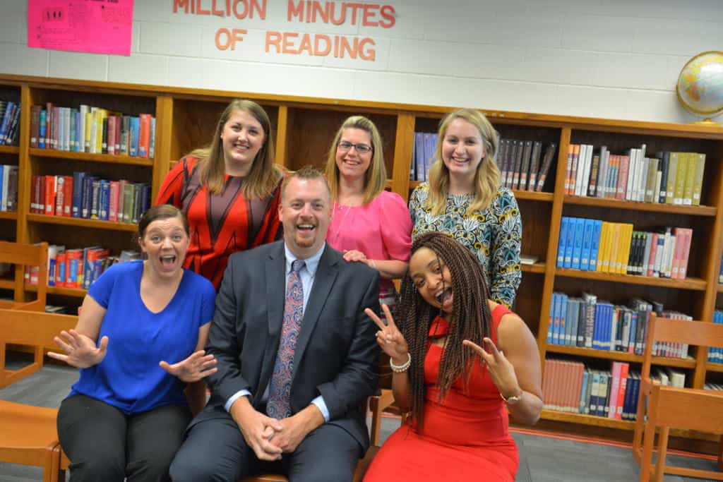 Dr. Harvey with his cohort, including from L-R on the front row, Roxanne Breitenfeld and Chevy Coffey and L-R on the back row, Kayla Losh, Ashley Ponscheck, and Jessica Hall.