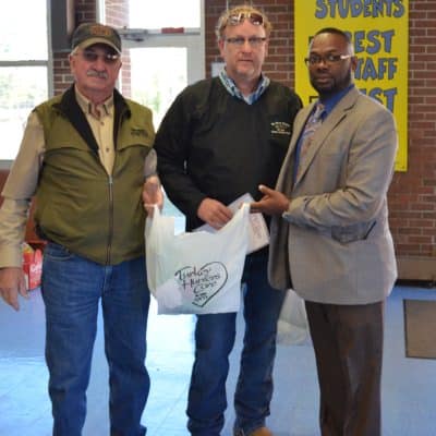 Left to right, Jim Vickers and John Edmondson from the National Turkey Foundation, and Claude Archer, principal of West Edgecombe Middle School (Photo Credit: Alex Granados)