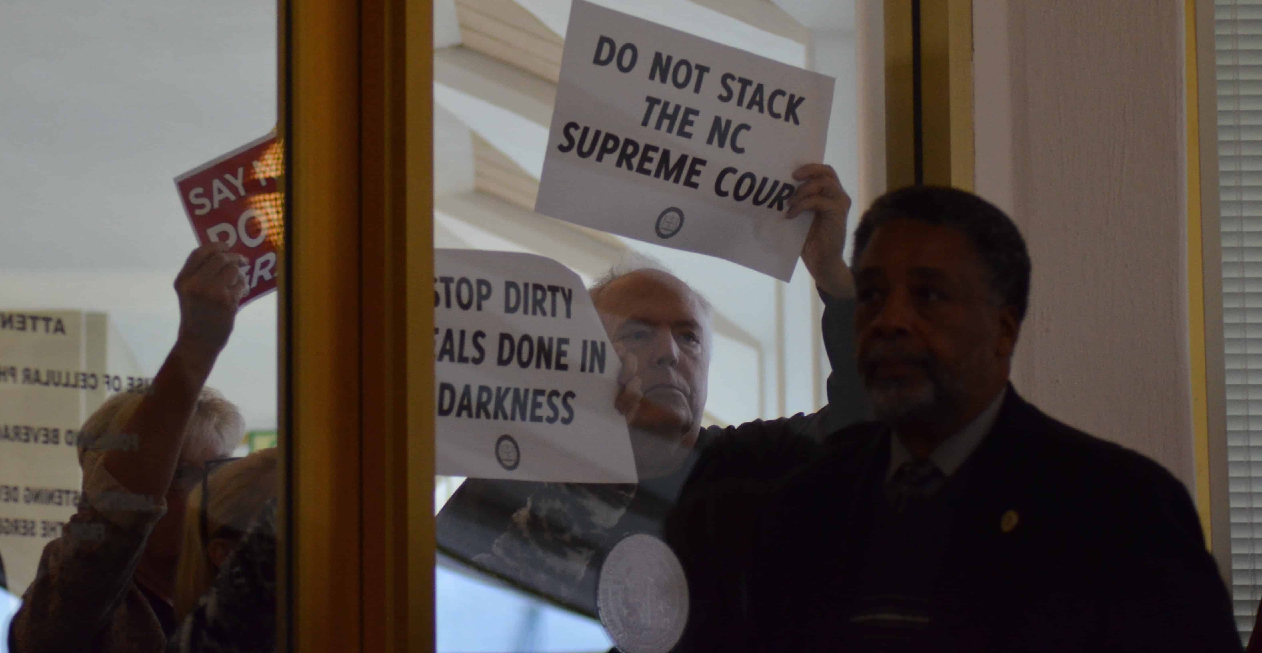 Protesters stand just outside the House chamber during the Special Session (Photo Credit: Alex Granados)