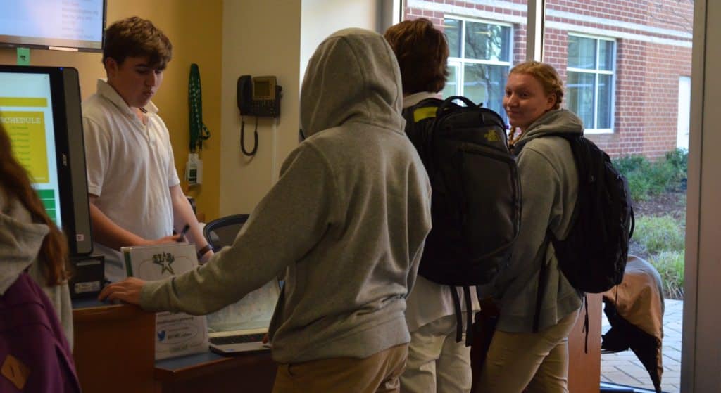 Students seek help at an IT help desk run by other students (Photo Credit: Alex Granados/EducationNC)