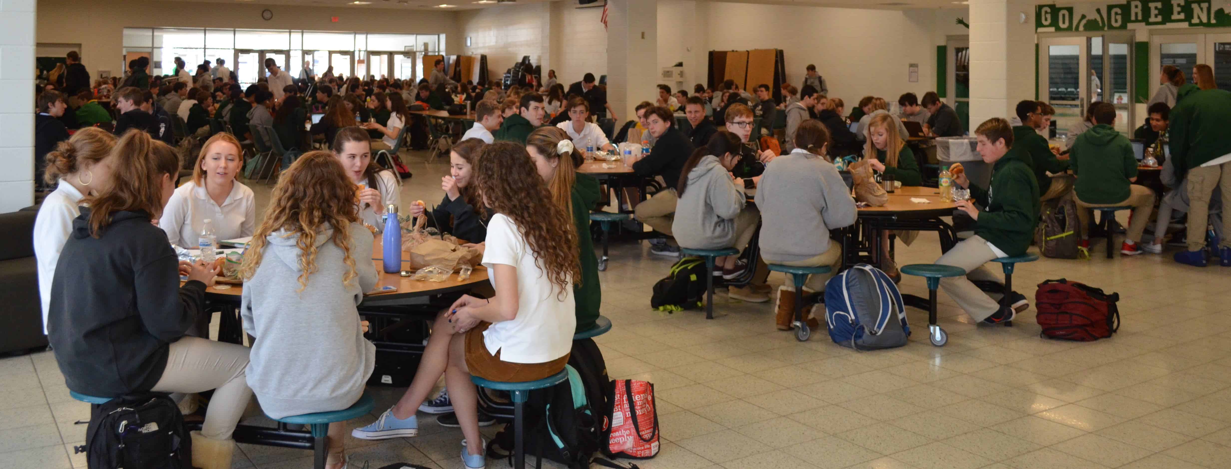 Students eating lunch at Cardinal Gibbons (Photo Credit: Alex Granados/EducationNC)