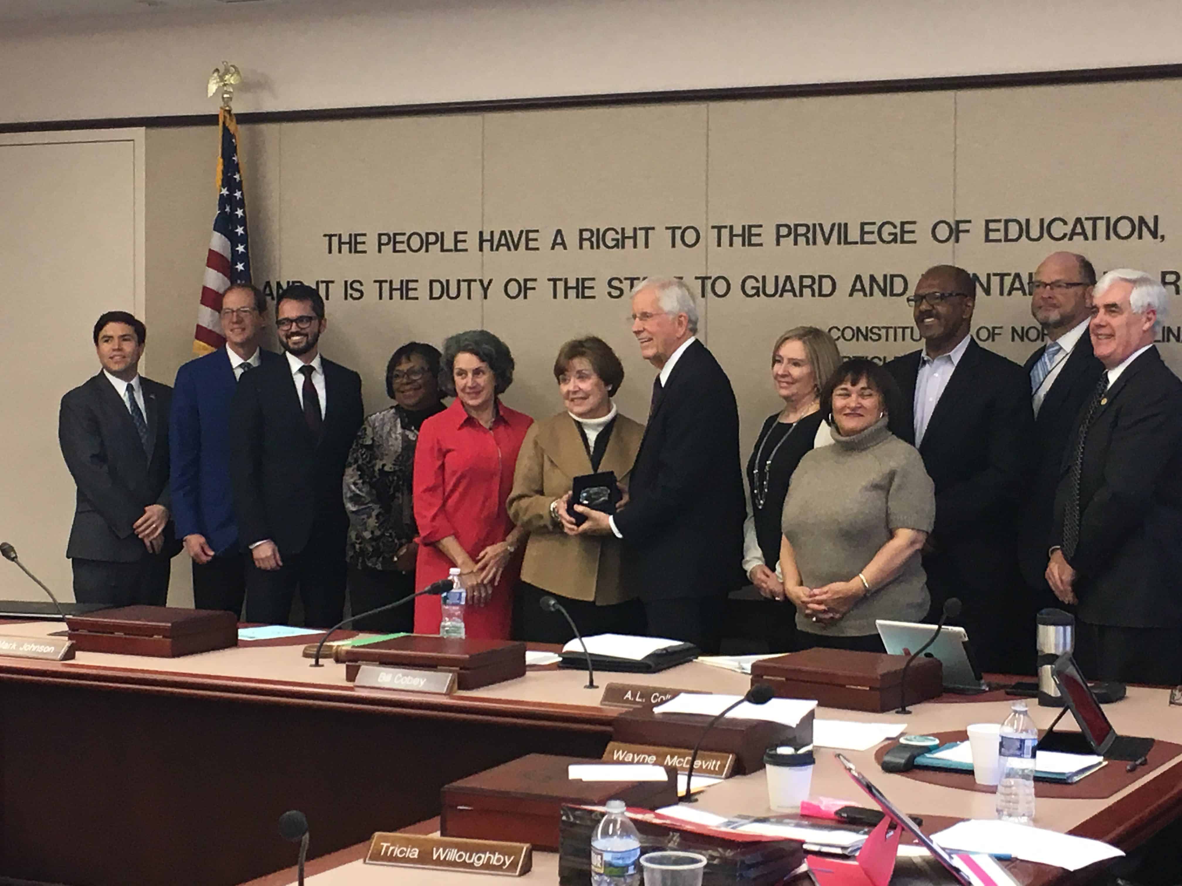 Deputy State Superintendent,  center, is honored for her work at DPI (Photo Credit: Alex Granados/EducationNC)