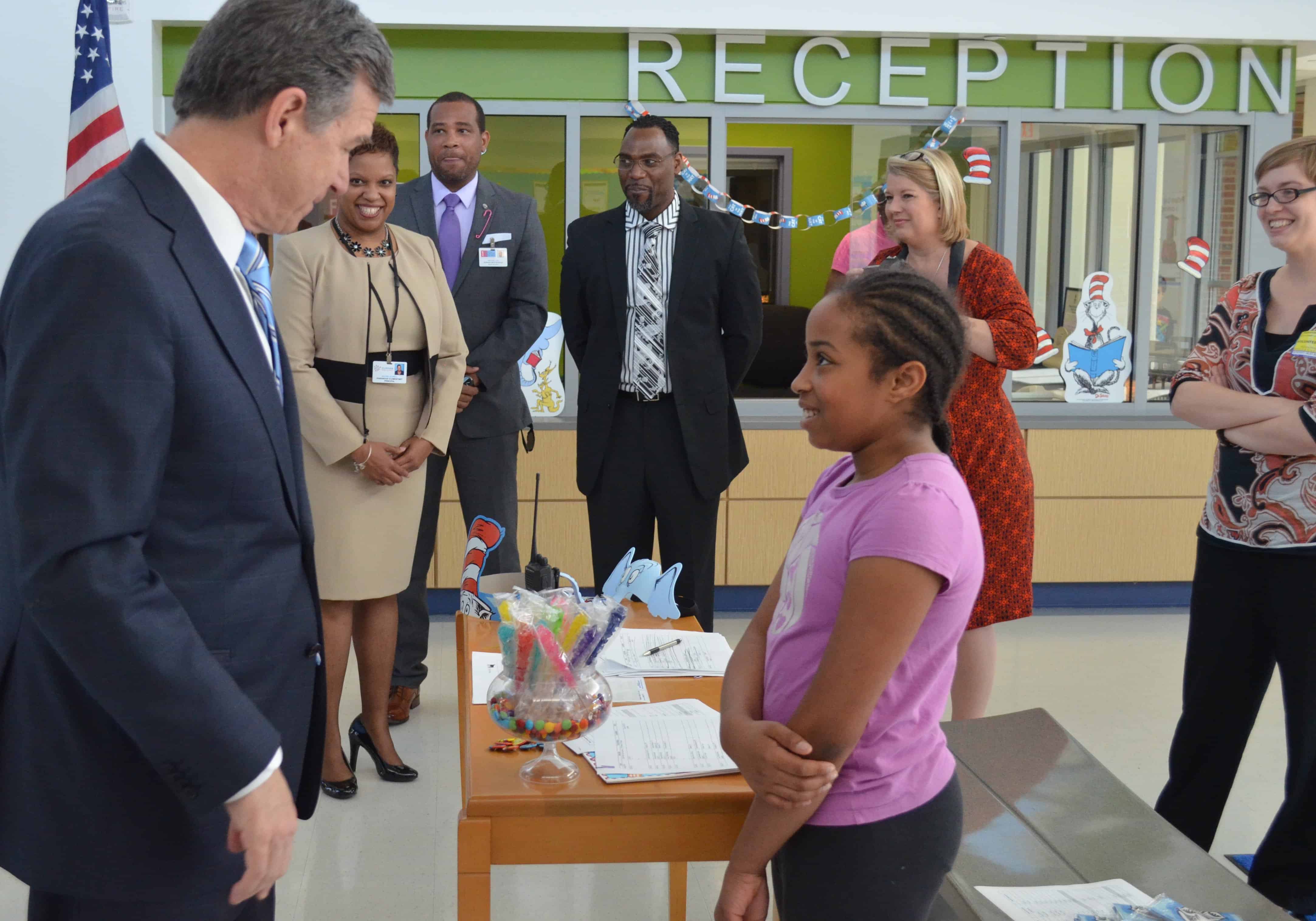 Governor Roy Cooper talks to Parkwood Elementary 4th grader Skai Fisher