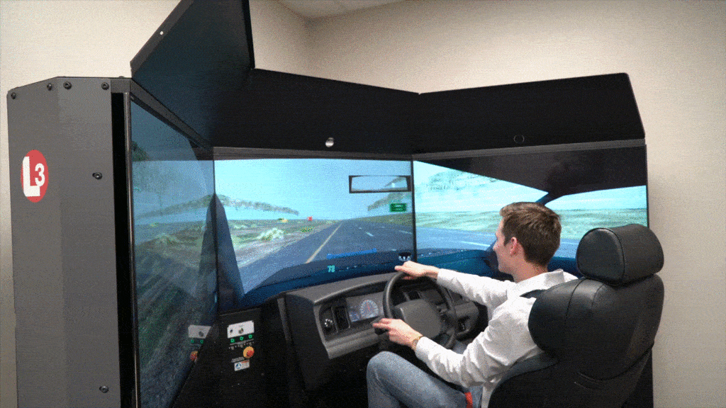 Robert crashing the cop car driving simulator