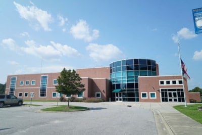 a building with large glass dome windows and bricks