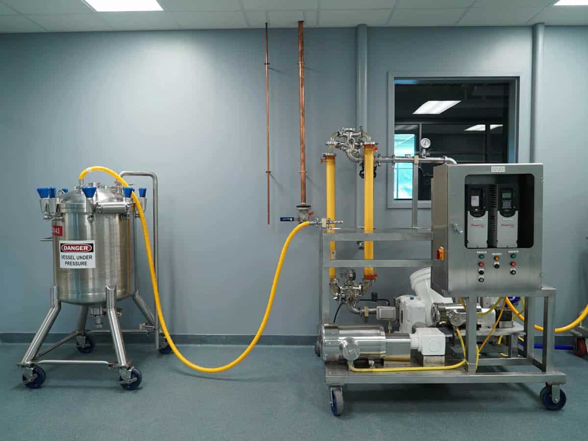 Metal machinery connected with yellow tubing