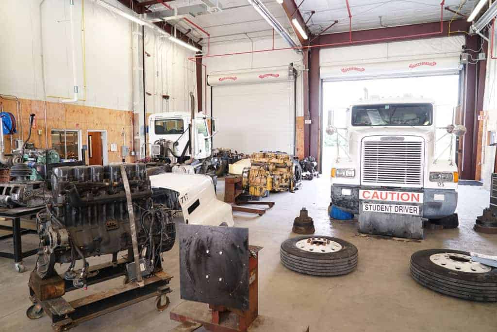 a big rig in garage with equipment