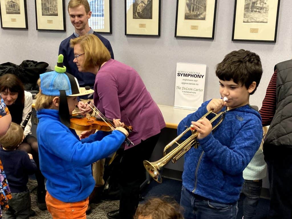 Two boys playing instruments in Rocky Mount with Music Discovery program. Caroline Parker/EducationNC