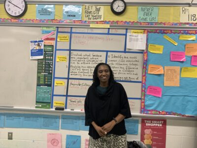 Teacher standing in front of whiteboard