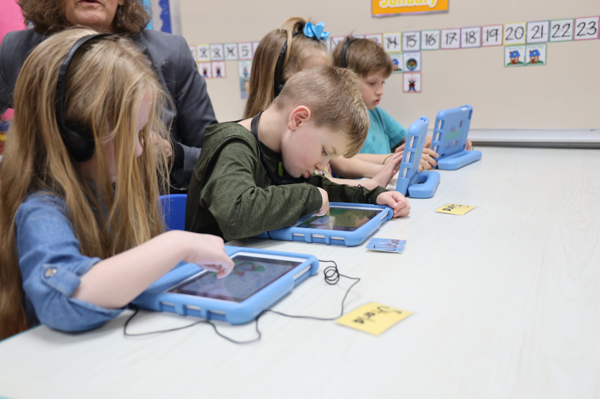 Young students learn on their Seedlings in the classroom at Ashe Early Learning Center. Laura Browne/EducationNC