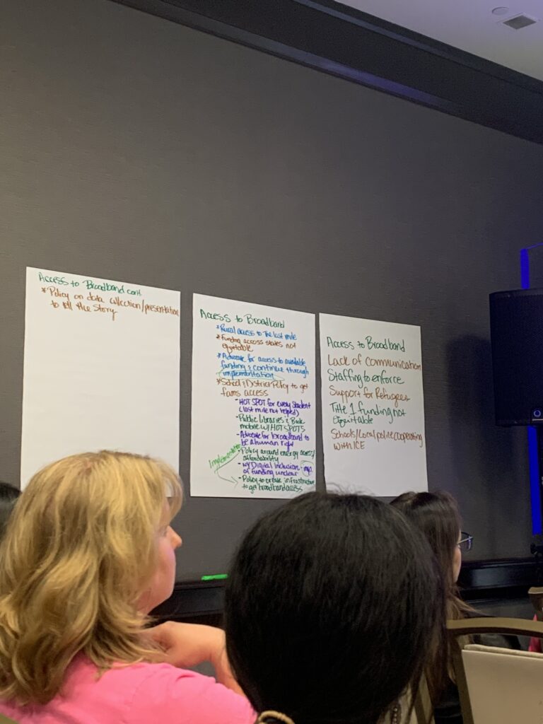 notes on the wall in various marker colors about broadband access