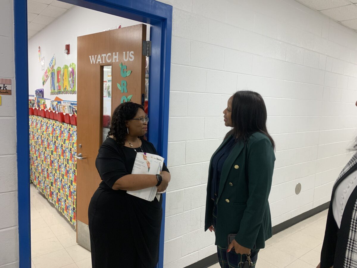 teachers standing at class door