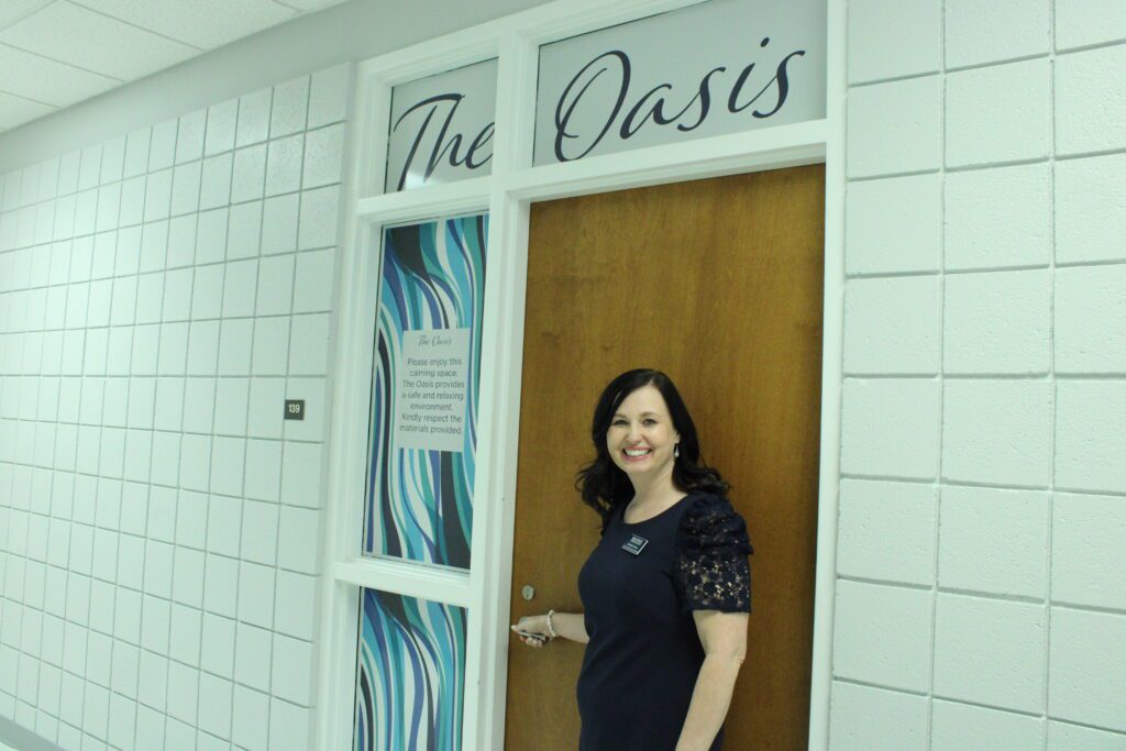 woman standing in front of office door
