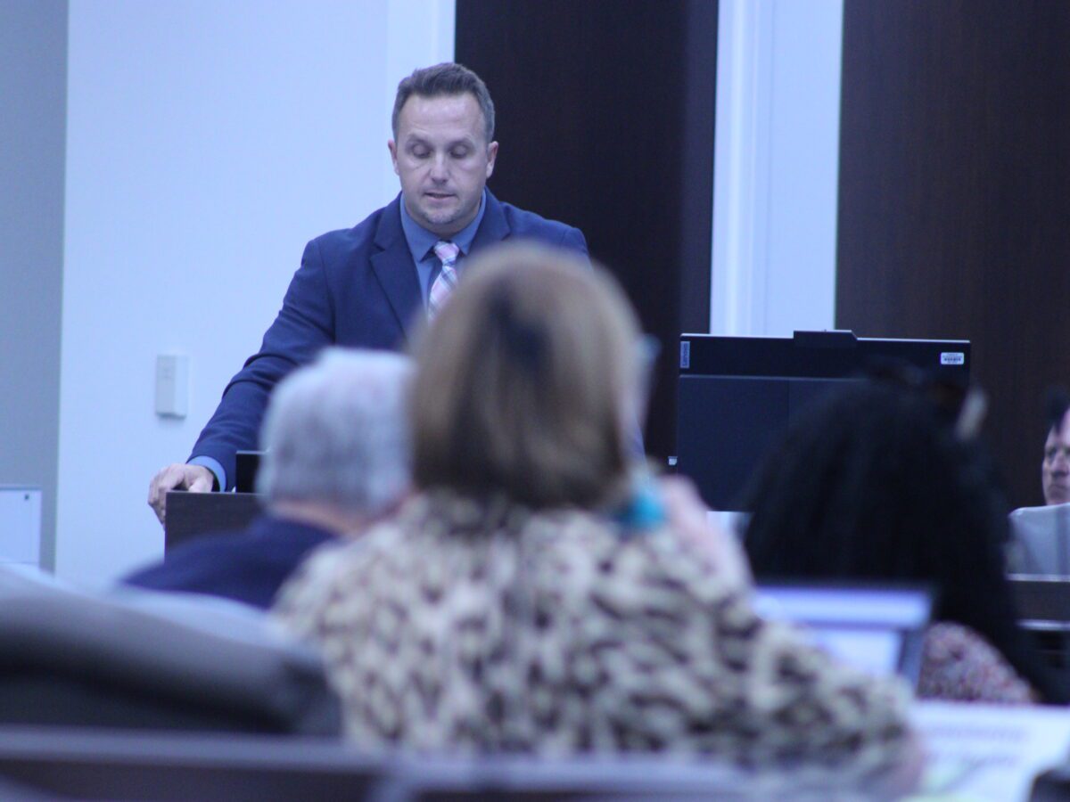 man standing at podium