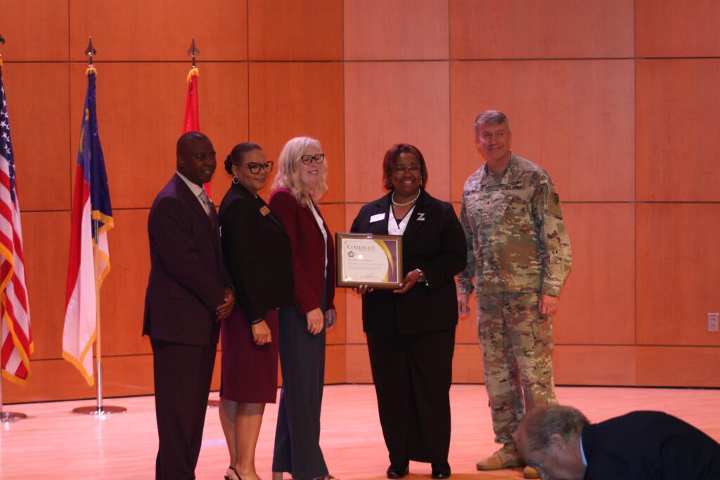 people holding a certificate