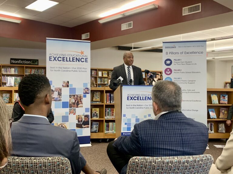 mo green standing at a podium