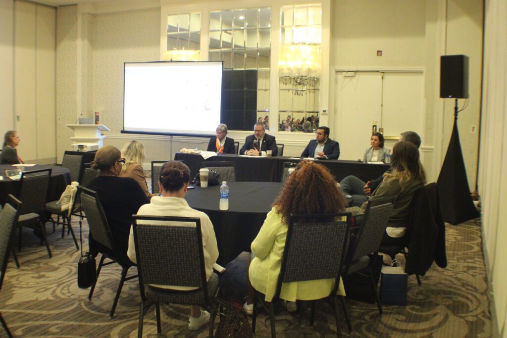 people sitting at tables with black table cloth