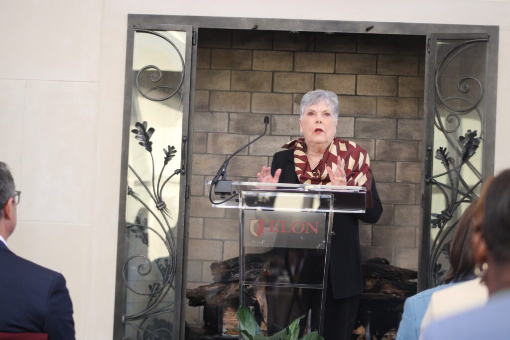 woman speaking at podium