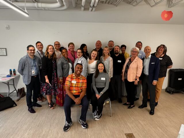 people in a group picture smilinng