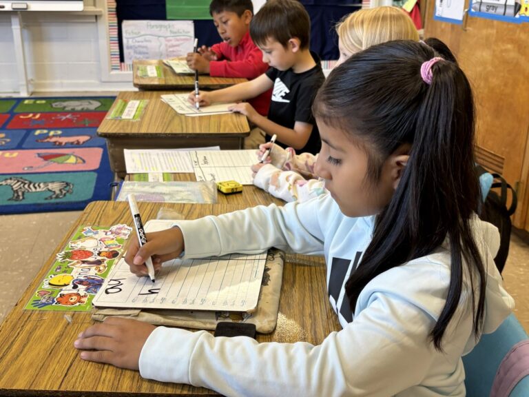 Second grade students work on encoding sounds.