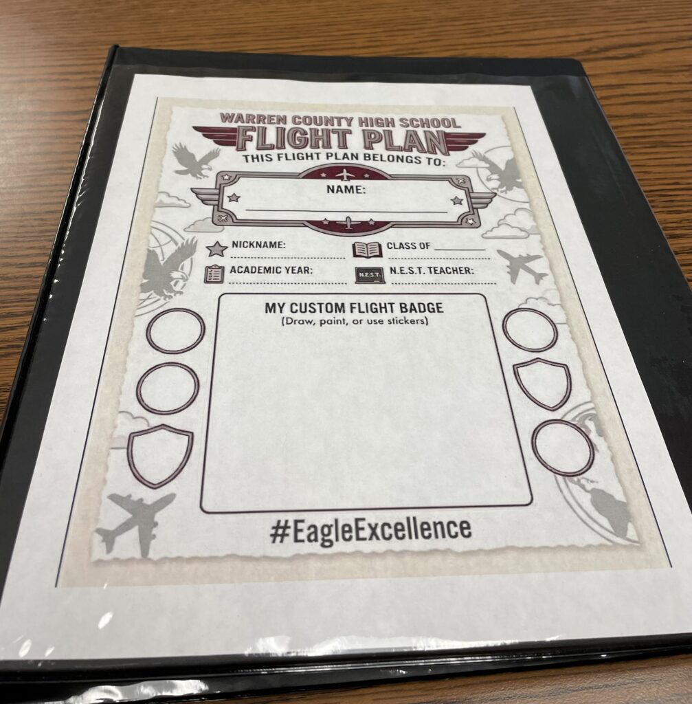 black binder opened to the page "Warren County High Flight Plan"