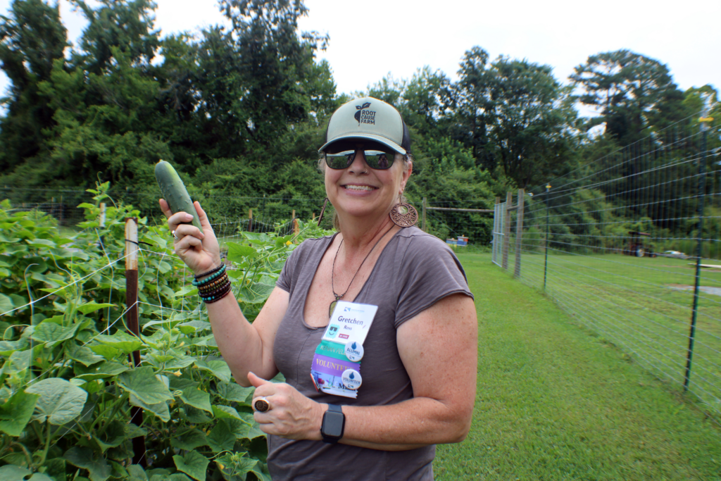 Woman holding a cucumber