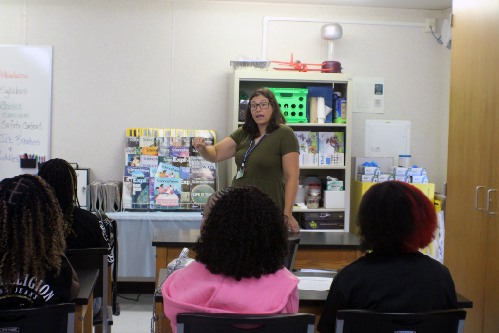 woman standing in front of class