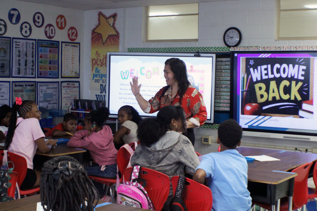 woman speaking in middle of classroom
